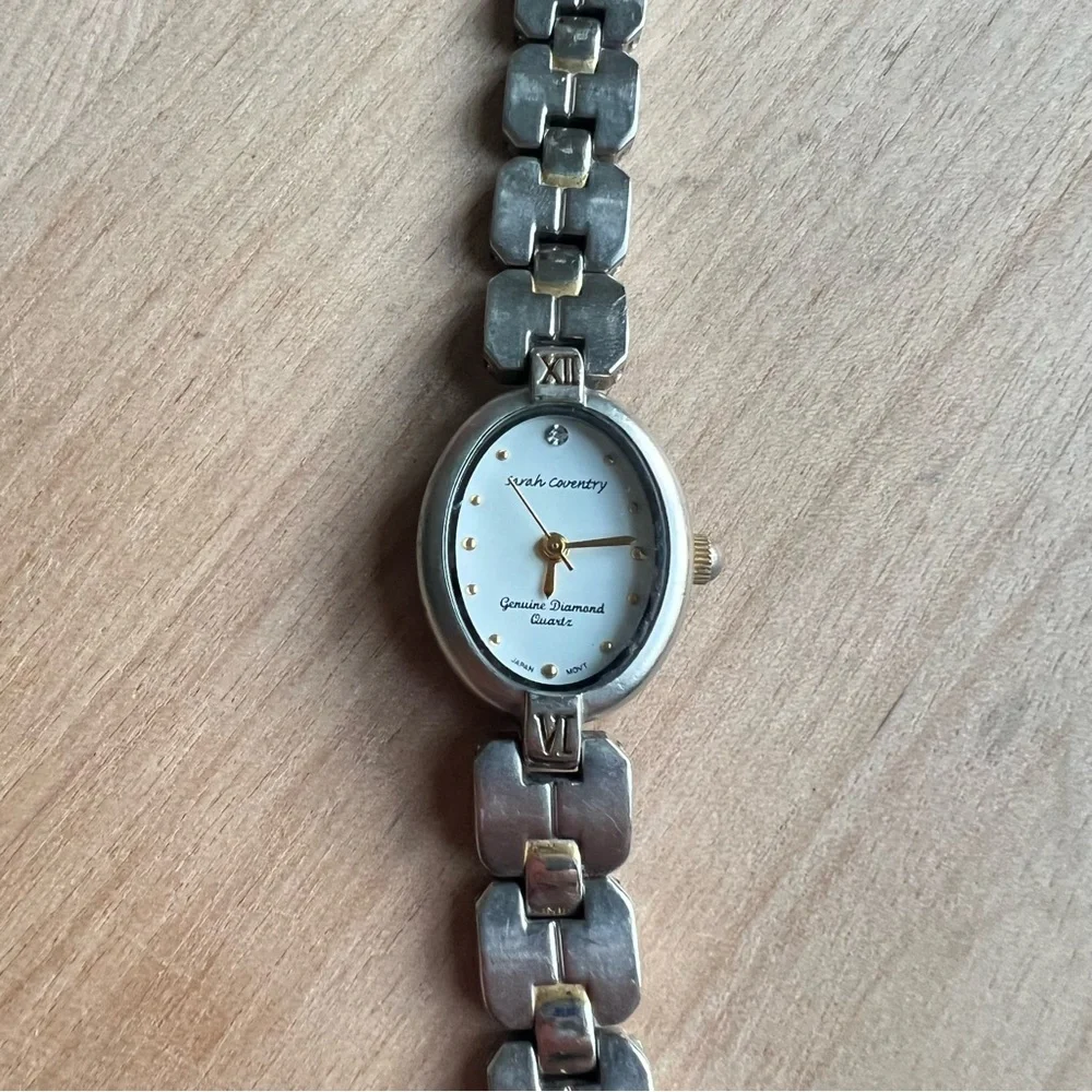 Sarah Coventry ladies oval silver tone diamond dress Watch NEW BATTERY